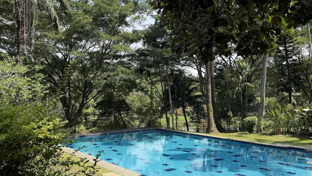 Tanarata International Schools campus surrounded by greenery and hills